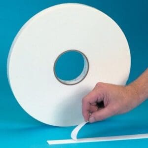Blue background with adhesive tape roll