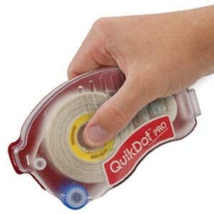 Hand holding adhesive tape dispenser